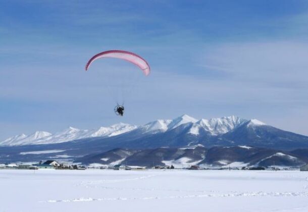Tandem motor paraglider experience! View Furano from above